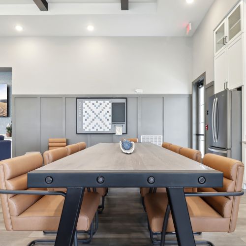 Entertain in the expansive clubroom, complete with a large flat screen TV, pool table, kitchen, and outdoor covered lanai with stunning views. 	