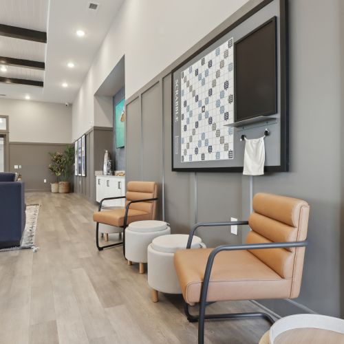 Entertain in the expansive clubroom, complete with a large flat screen TV, pool table, kitchen, and outdoor covered lanai with stunning views. 	