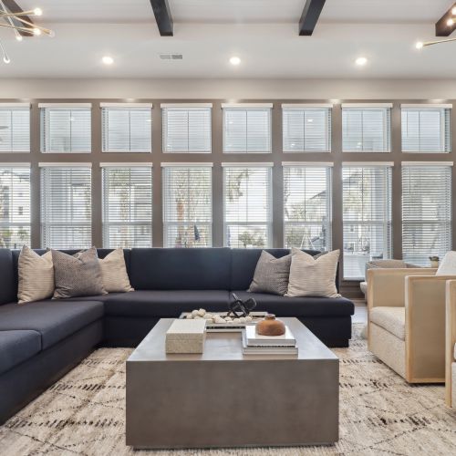 Entertain in the expansive clubroom, complete with a large flat screen TV, pool table, kitchen, and outdoor covered lanai with stunning views. 	