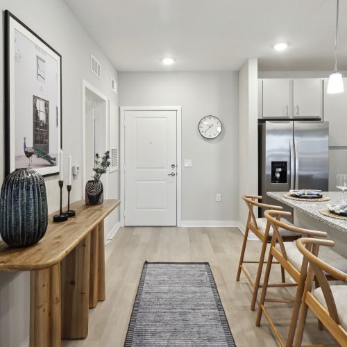 Well-appointed kitchens feature stainless steel appliances, granite countertops, and tiled backsplashes.	