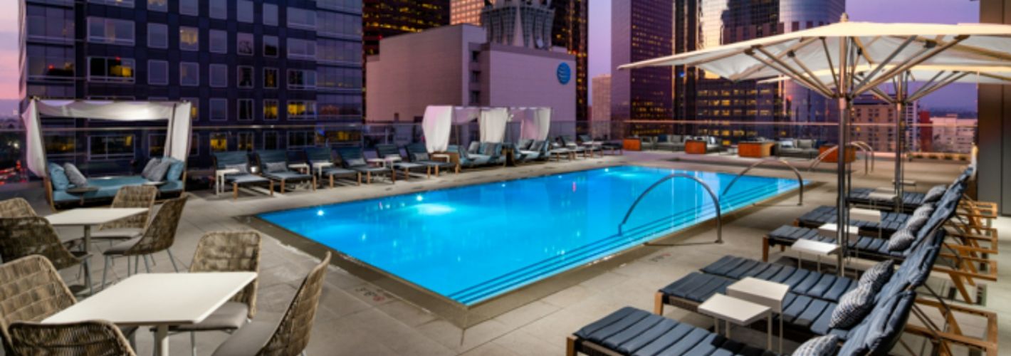 Park Fifth : Pool with dusk city skyline
