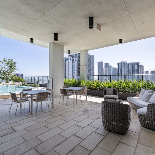 Rooftop lounge spaces allow you to sit poolside with views of the city