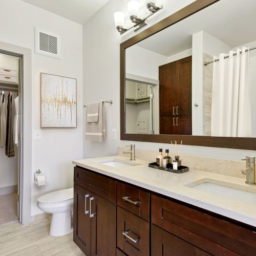 Rich, dark cabinetry and large closet spaces.