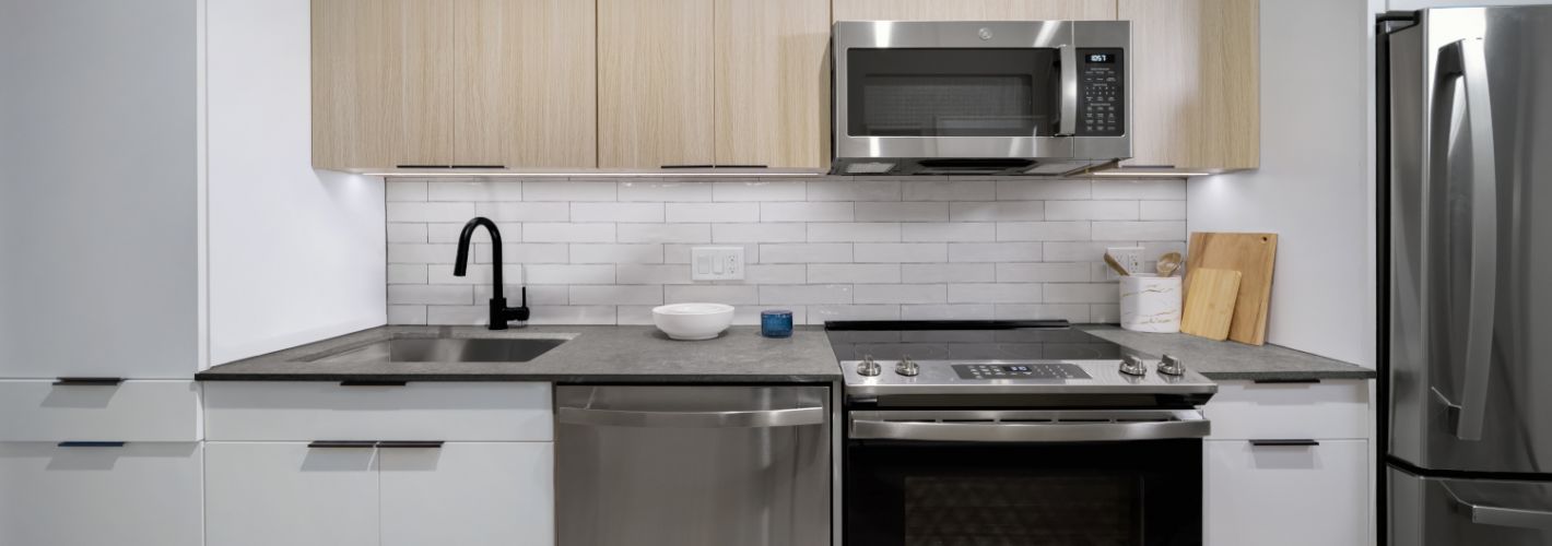 The 202 | Now Leasing : Embrace spacious kitchens with quartz countertops and stainless steel appliances.	
