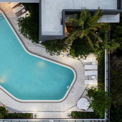 Aerial view of rooftop pool at sunset
