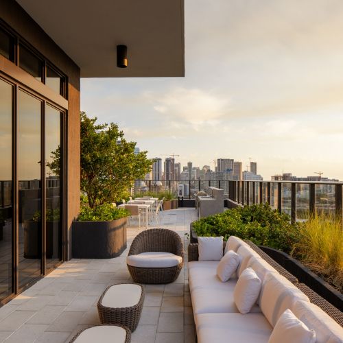 Rooftop lounge and grill area at sunset