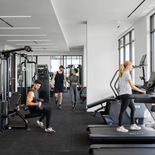Spacious fitness center with Miami skyline views