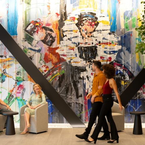 Meet up with friends near the colorful lobby mural