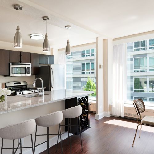 Cook in style with our gas stovetops and sleek bottom-freezer fridges, complemented by a rich cherry wood palette