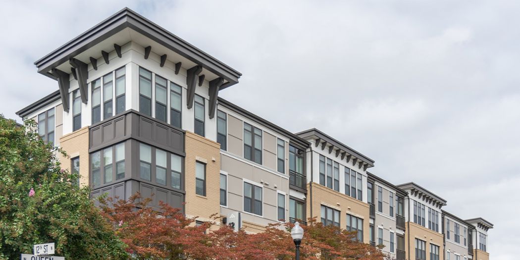 The upper half of the building front for Alcott apartments