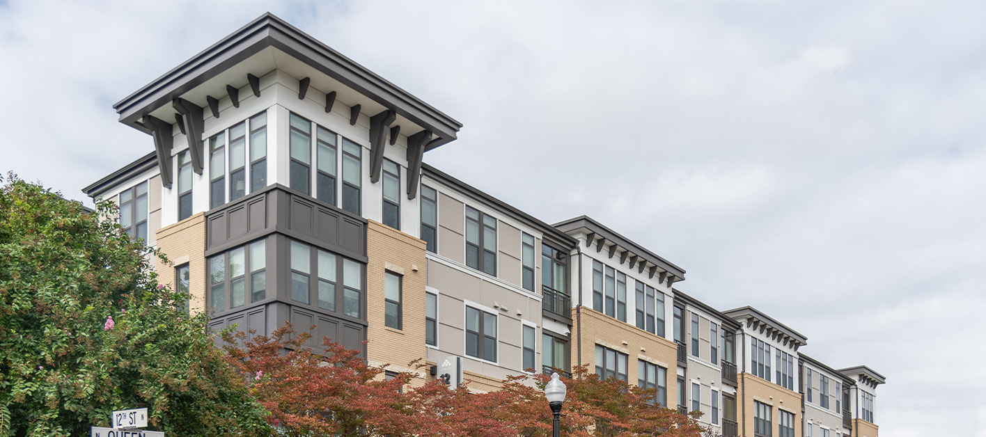 The upper half of the building front for Alcott apartments