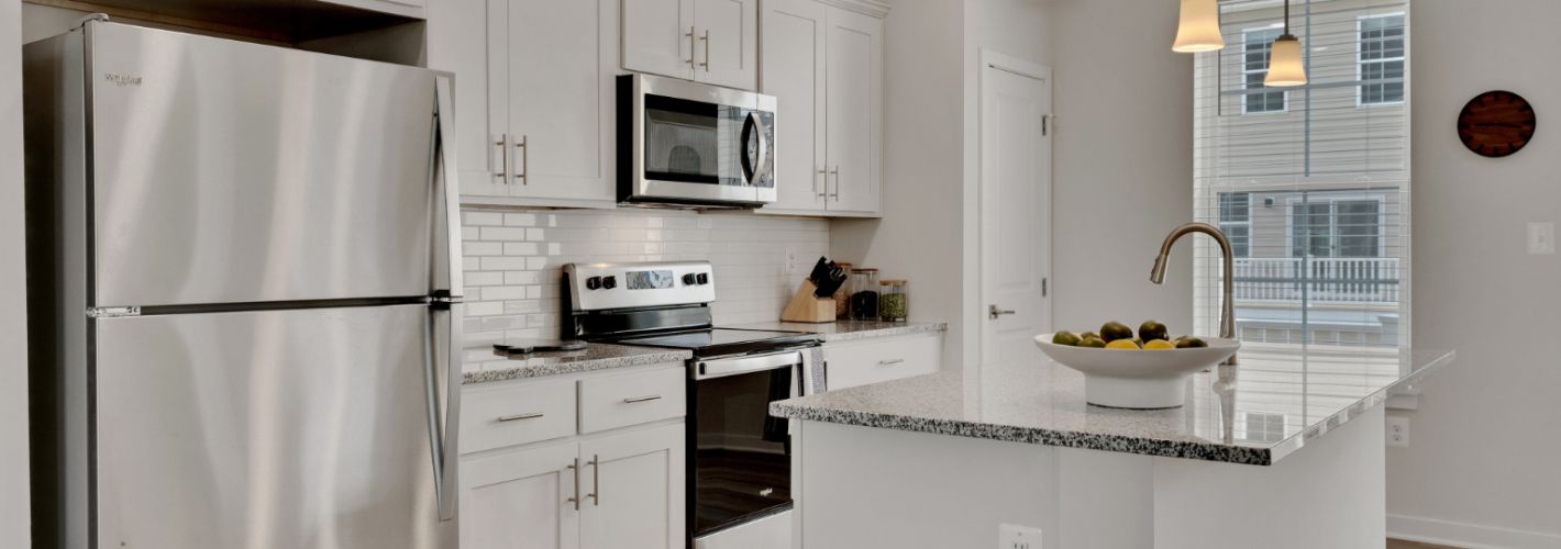 Kitchen with island and stainless steel appliances 