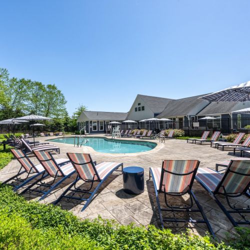 Outdoor pool with lounge chairs	
