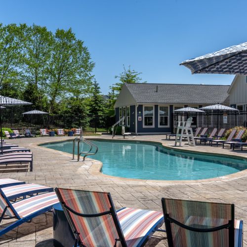 Outdoor pool with lounge chairs	