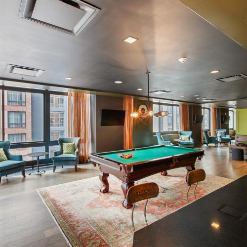 Game room with pool table and seating
