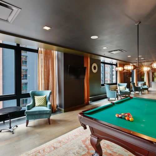 Game room with pool table and seating