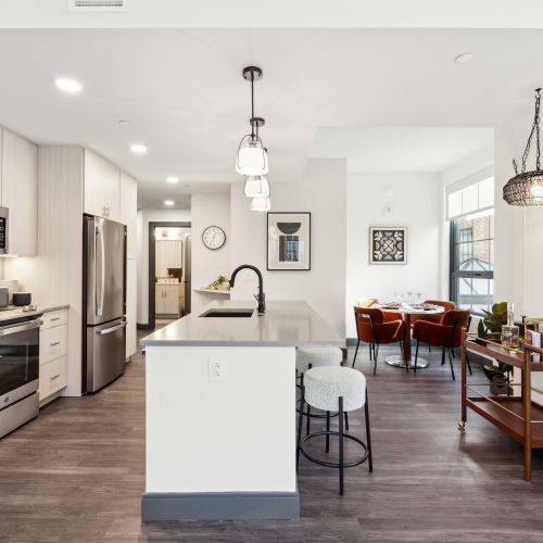 Apartment kitchen with dining table in back corner