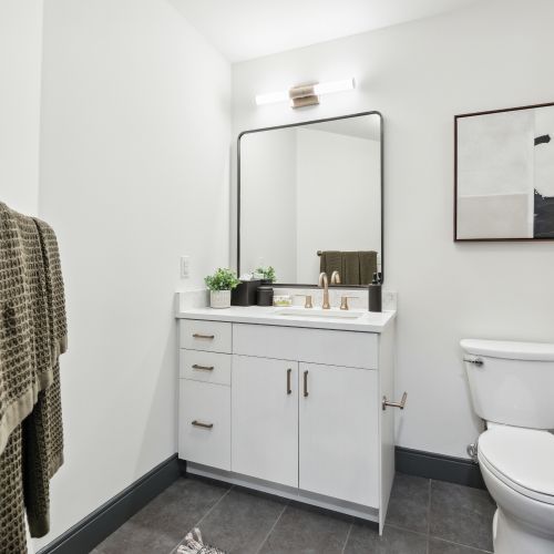 Bathroom with white finishes and vanity 