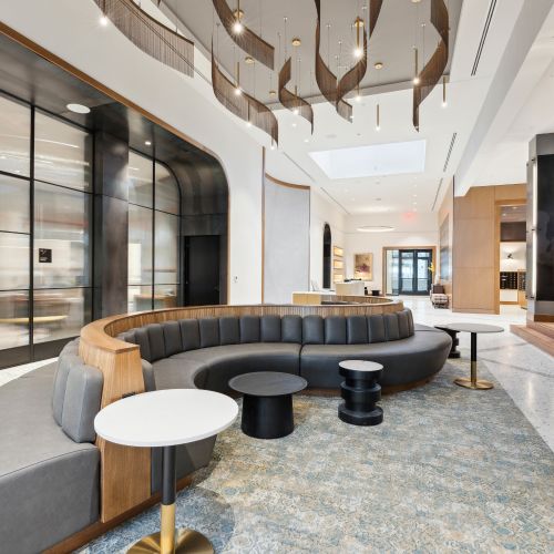 Long couch for seating with greenery wall