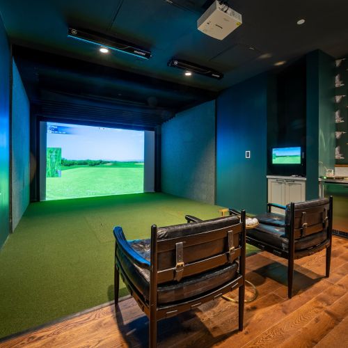 Golf simulator with seating and bar area	