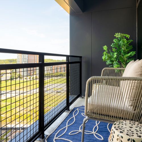 Retreat to your private balcony and enjoy a sweeping view of Tysons	