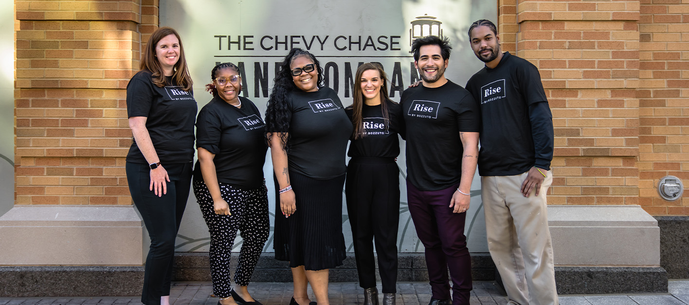 Six individuals wearing 'Rise by Bozzuto' shirts