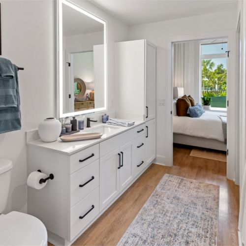 Model apartment bathroom looking into bedroom 