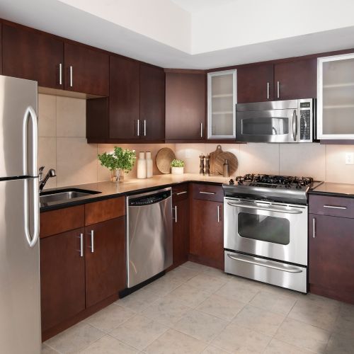 Rich dark cherrywood cabinetry makes the perfect setting for meal time	