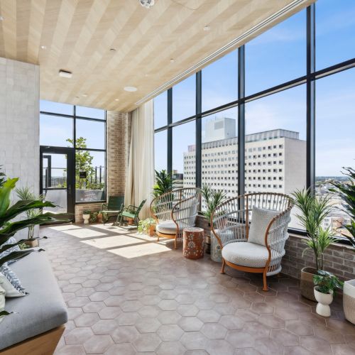 Conservatory with seating and large windows	