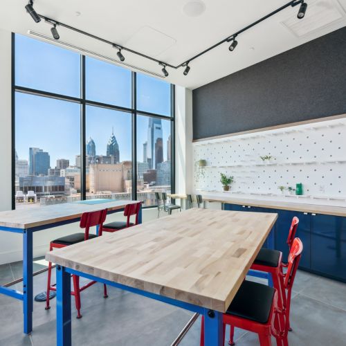 Art studio with tables and sink 	