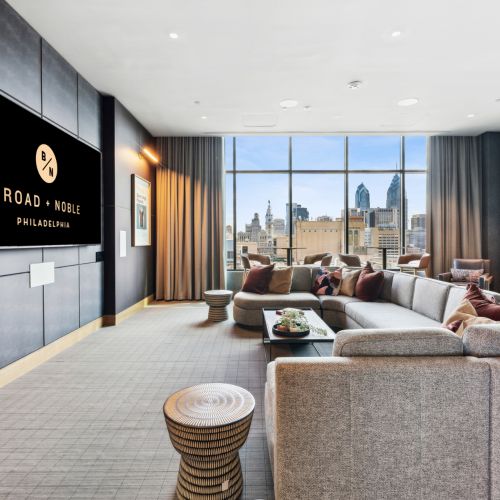 Media room with large TV and couch	