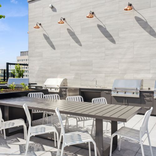 Rooftop deck with dining area and grills	