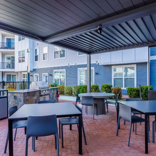 Covered outdoor dining area and grills	