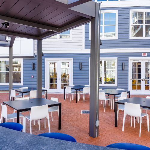Outdoor dining and bar seating in courtyard 	