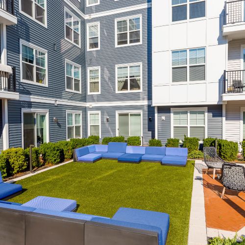 Outdoor lounge chairs on grassy area	