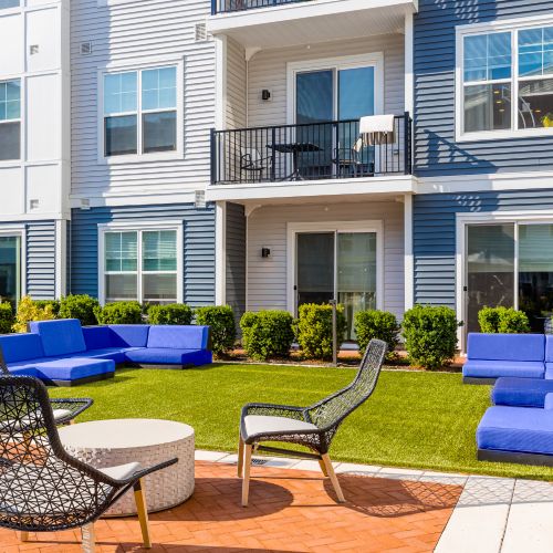 Outdoor lounge chairs on grassy area	