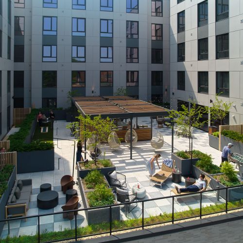 Outdoor terrace with seating, grills and firepit	