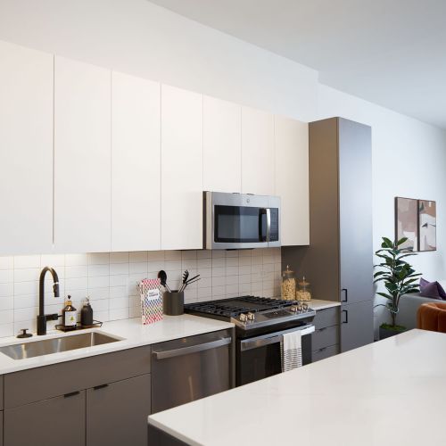 Modern kitchens with stainless steel applicances	
