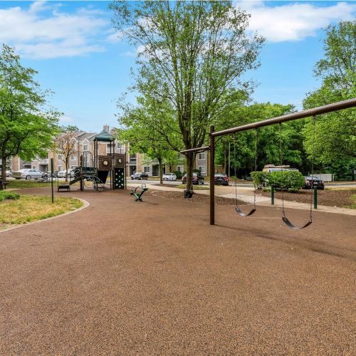 Woodbridge Station community playground with swings