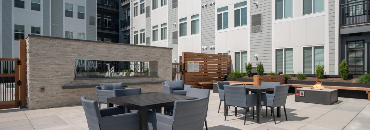 Outdoor firepit area with modern seating.