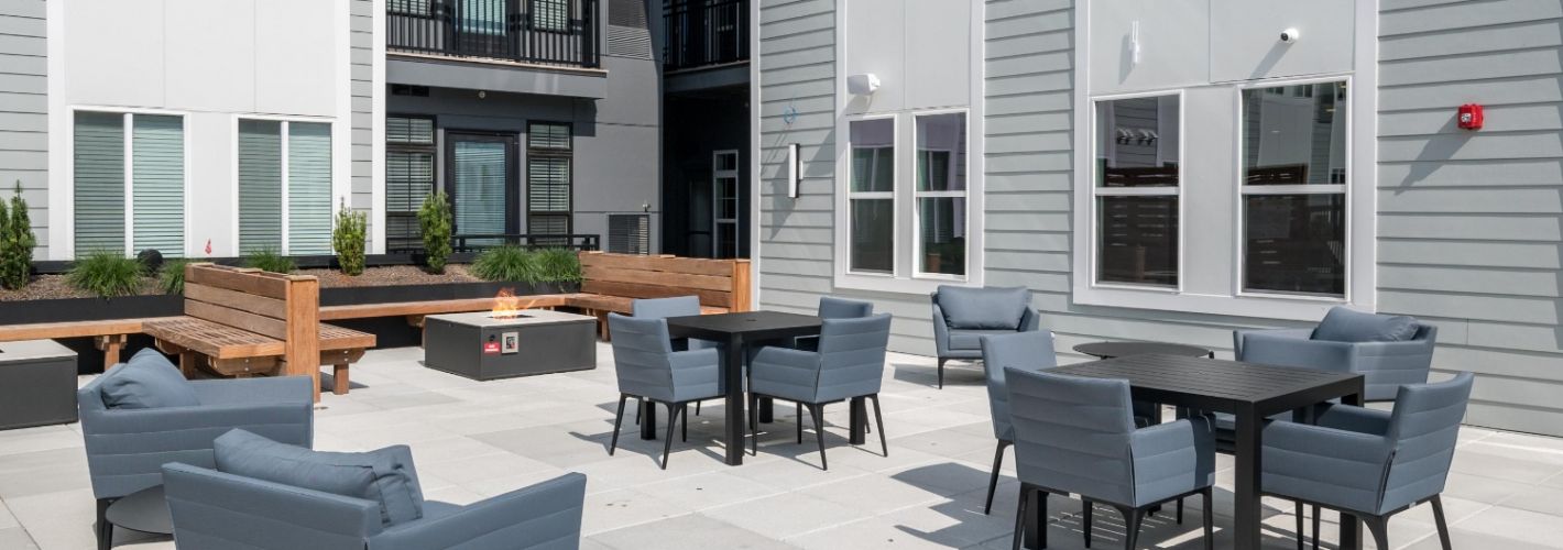 Stylish firepit in an outdoor lounge setting.