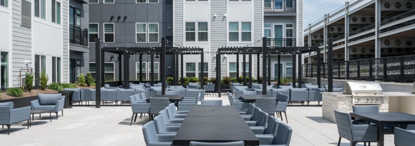 Comfortable outdoor seating area with tables.