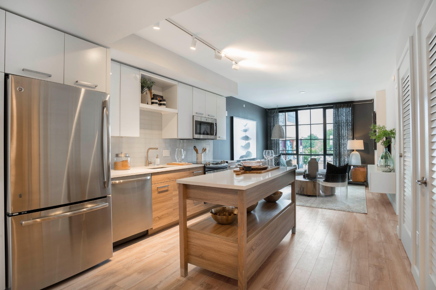 Kitchen with island and view of living room