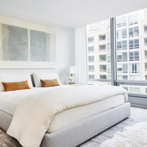 Apartment bedroom with expansive windows 