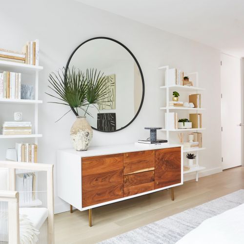 Decorated living room with bookcases and storage
