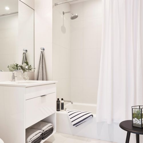 All white bathroom with bathtub