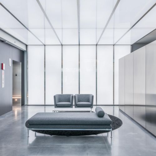 Lobby with seating next to elevators 