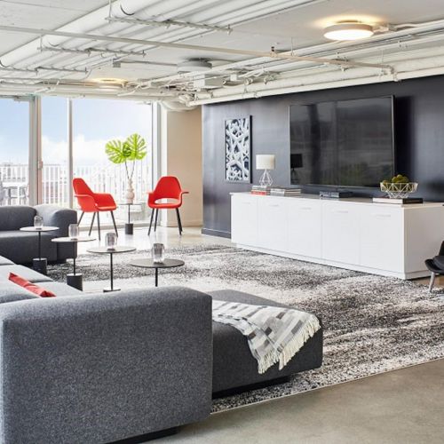 Resident lounge with ample seating options and large TV