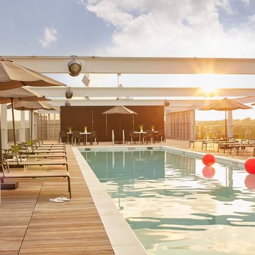 Rooftop deck with ample seating by the pool