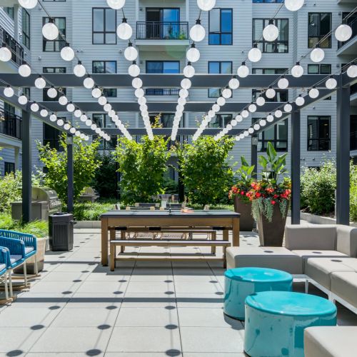 Enjoy a cozy evening under the twinkle lights at our rooftop lounge.	